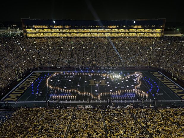 The marching band forming a lighted map on the football field during a night game, HD Desktop Wallpaper