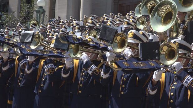 A marching band is performing with brass instruments outdoors, HD Desktop Wallpaper