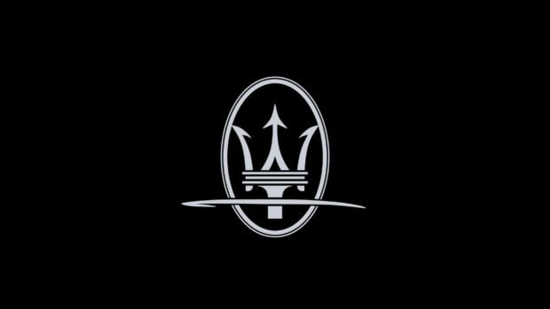Maserati logo symbol is centered on a black background with a sharp trident design