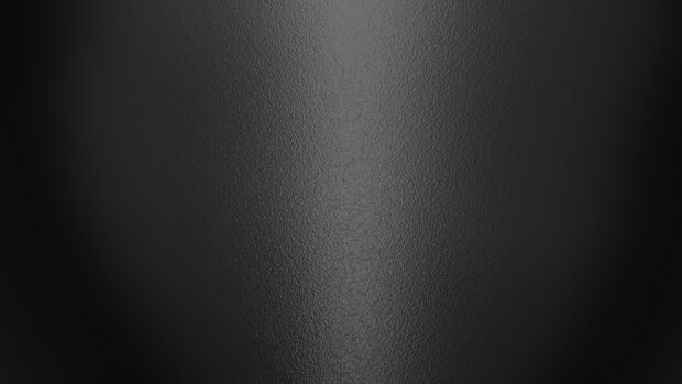 A close up view of a matte black surface texture with subtle lighting, 4K Desktop Wallpaper