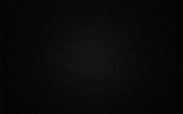 A close up of matte black texture showing subtle patterns and details, 2K Desktop Wallpaper