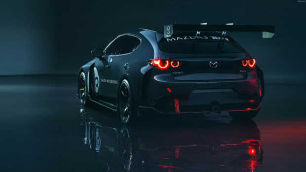 A Mazda racing car with illuminated taillights stands on a reflective surface at night, 4K Desktop Wallpaper