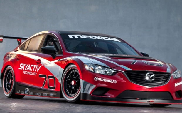 A red Mazda racing car with Skyactiv technology logo and the number 70 on the side, HD Desktop Wallpaper