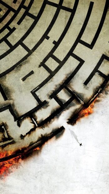 A lone figure standing near a maze with fiery edges in a high resolution 2K maze design
