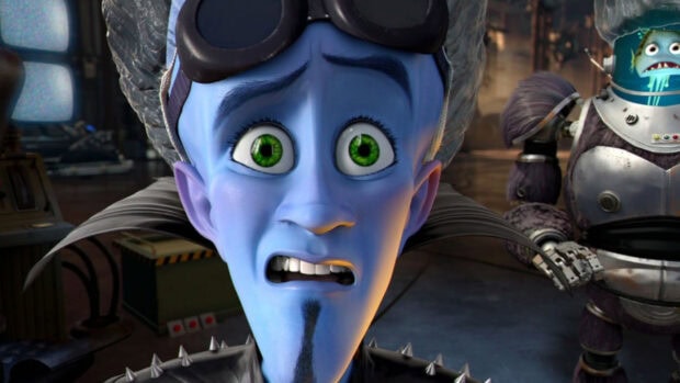 Megamind character with green eyes and a shocked expression in a lab setting