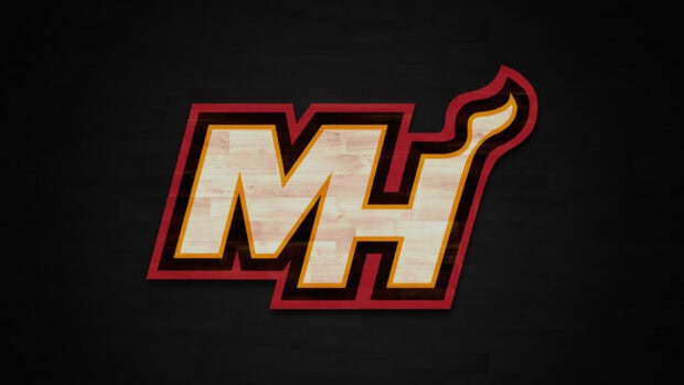 Miami heat logo with a wooden texture on a dark basketball court floor background