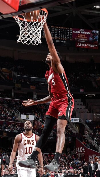 Miami Heat player dunking the ball in a professional basketball game