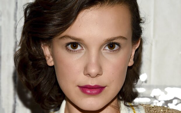 Millie Bobby Brown looks directly at the camera with confident expression, HD Desktop Wallpaper