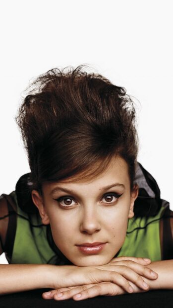 Millie Bobby Brown shows a calm expression with her hands folded, HD Mobile Wallpaper