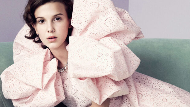 Millie Bobby Brown Wallpapers shows a close up of her wearing a detailed pink dress, 4K Desktop Wallpaper