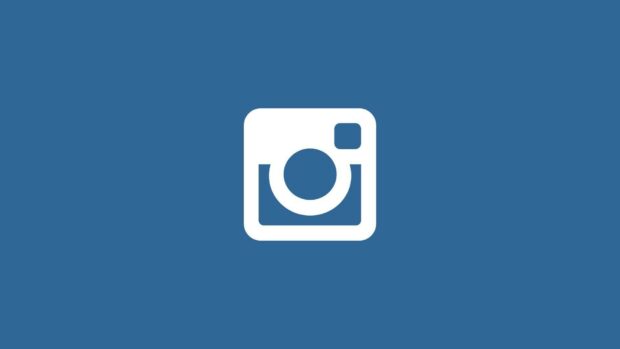The Instagram icon is displayed in white on a solid blue background for Instagram Wallpapers, HD Desktop Wallpaper