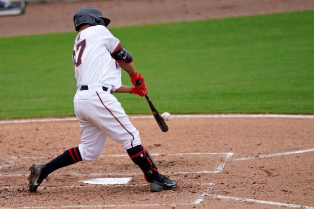 A Minnesota Twins player swings the bat during a baseball game at the home plate, 2K Desktop Wallpaper
