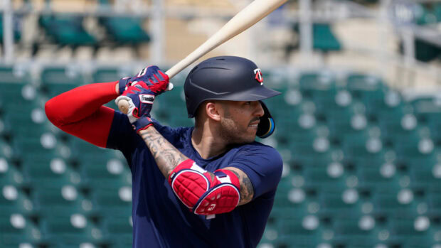 A Minnesota Twins player prepares to bat during practice at the stadium, 2K Desktop Wallpaper