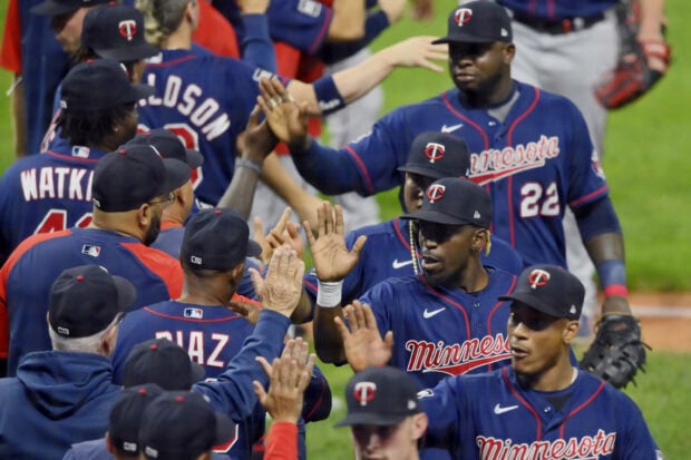 Minnesota Twins players are celebrating a win on the field after the game, 2K Desktop Wallpaper