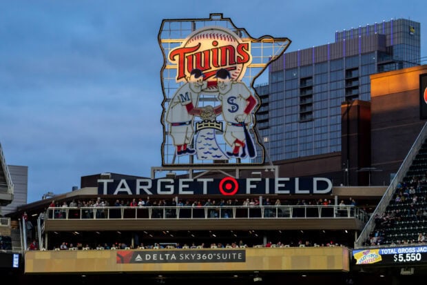 The Minnesota Twins logo is displayed prominently at Target Field stadium during dusk, 2K Desktop Wallpaper