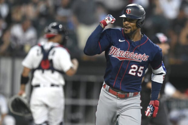A Minnesota Twins player celebrates on the field during a baseball game, 2K Desktop Wallpaper