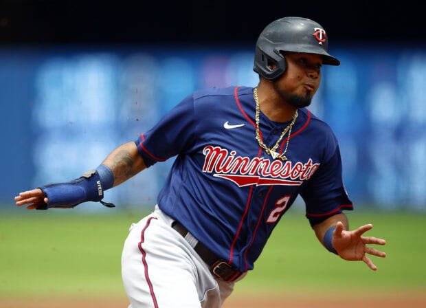 A Minnesota Twins player runs the bases during a game, HD Desktop Wallpaper