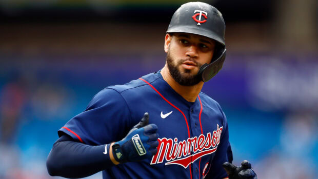 A Minnesota Twins player is running during a baseball game wearing the team's uniform, HD Desktop Wallpaper