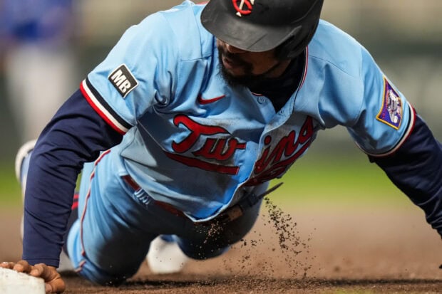 A Minnesota Twins player slides into base during a game, 2K Desktop Wallpaper