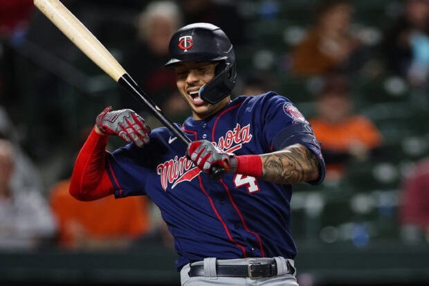 A Minnesota Twins player is preparing to swing the bat during a game, 2K Desktop Wallpaper