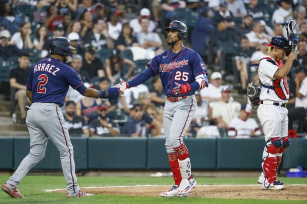 Minnesota Twins players celebrating on the baseball field during a game, 2K Desktop Wallpaper
