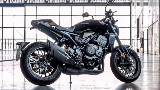 A sleek Honda Cb1000R motorcycle is parked indoors with bright windows in the background, HD Desktop Wallpaper