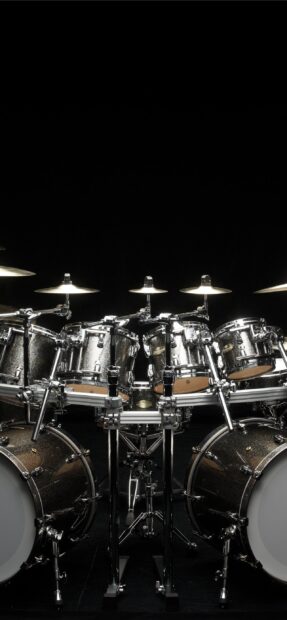 A detailed view of a modern drum set with cymbals and drums against a black background, 2K Mobile Wallpaper