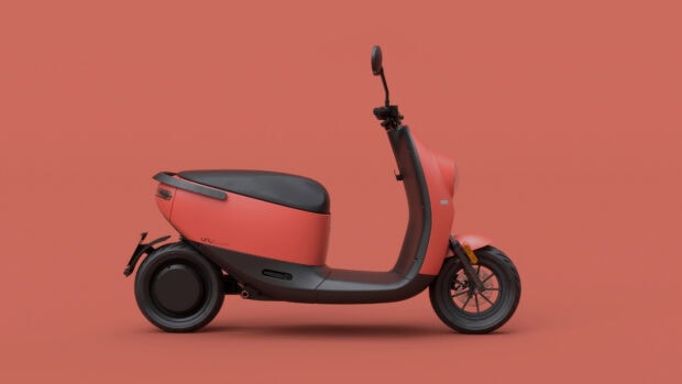 A modern red electric scooter is shown clearly from the side against a plain background, 4K Desktop Wallpaper