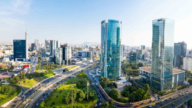 A panoramic view of Lima Peru featuring tall glass buildings and busy roads, HD Desktop Wallpaper