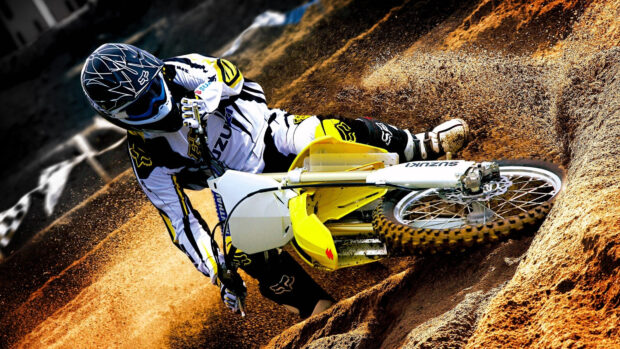 A motocross rider is sliding through a sandy dirt curve in intense motion, 4K Desktop Wallpaper