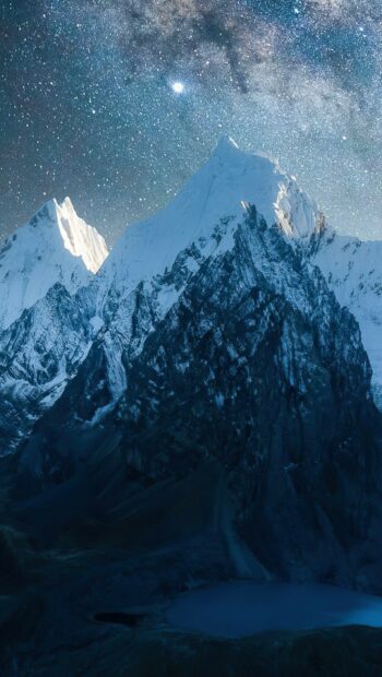 Stunning Mount Everest under a starry night sky with a visible Milky Way