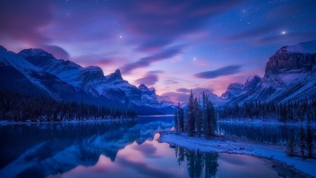 A mountain lake reflects snowy peaks and a colorful dusk sky in a tranquil scene, 2K Desktop Wallpaper