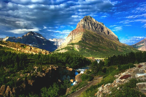 A scenic view of a mountain range and forest in Montana under a blue sky, HD Desktop Wallpaper