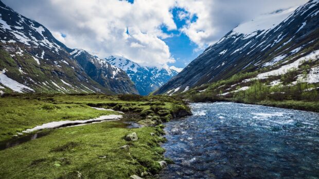 A peaceful mountain valley with a flowing river and snow covered peaks showcases natural scenery wallpapers, 2K Desktop Wallpaper