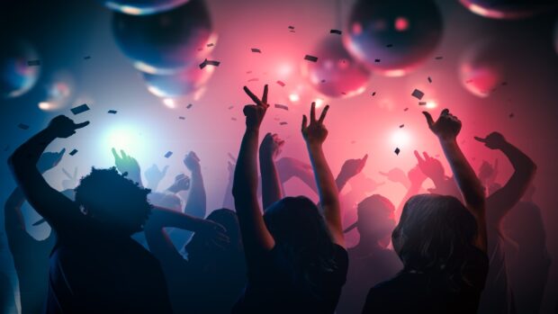 A lively nightclub scene with people dancing under vibrant lights and balloons, HD Desktop Wallpaper