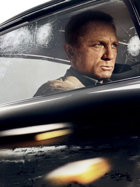 A man sits determined inside a car with shattered windows and bullet holes, HD Mobile Wallpaper