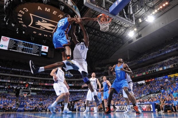 Kevin Durant of Oklahoma City Thunder jumping for a dunk during a basketball game against Dallas Mavericks