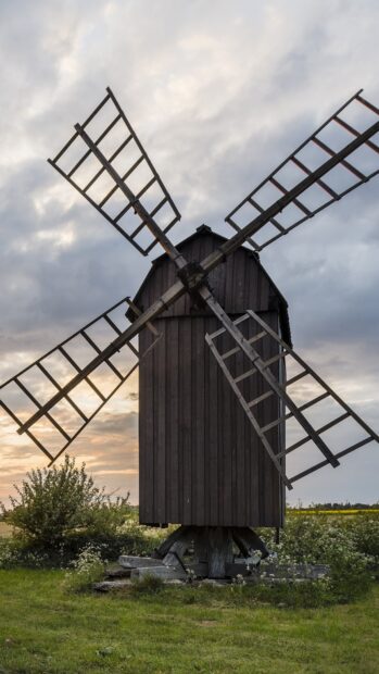 Traditional windmill structure in Oland Sweden at sunset