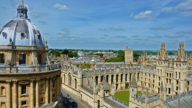 A clear view of Oxford University with its historic buildings and blue sky, 2K Desktop Wallpaper