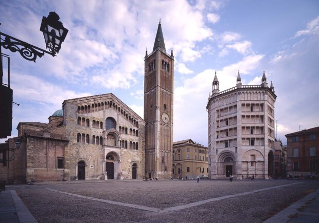 The historic architecture of Parma Italy with the cathedral and baptistery in a spacious square