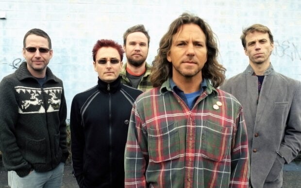 The Pearl Jam band stands together in front of a light blue wall, HD Desktop Wallpaper