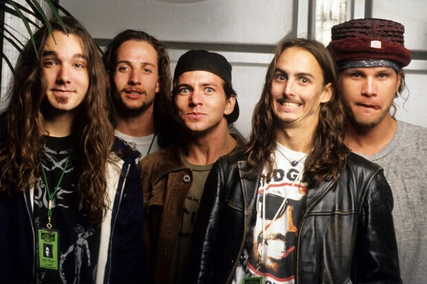 The five Pearl Jam band members are standing together in a casual setting, HD Desktop Wallpaper
