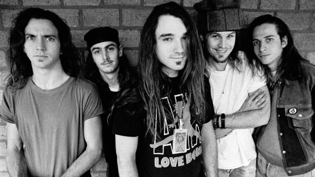 The Pearl Jam band members are standing together wearing casual clothes, HD Desktop Wallpaper