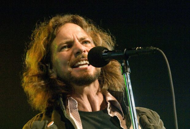 The Pearl Jam lead singer passionately performs during a concert with a close up on his face and microphone, HD Wallpaper
