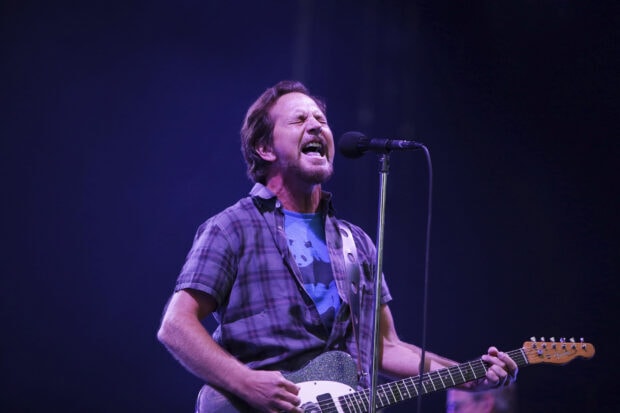 A Pearl Jam lead singer is passionately performing during a concert, HD Desktop Wallpaper