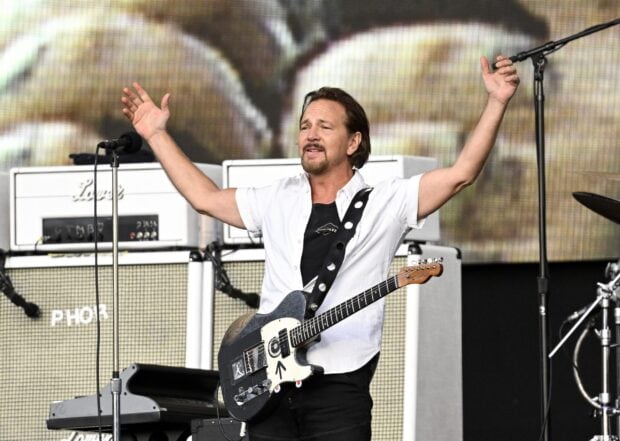 The Pearl Jam guitarist plays passionately on stage during a live concert, 2K Desktop Wallpaper