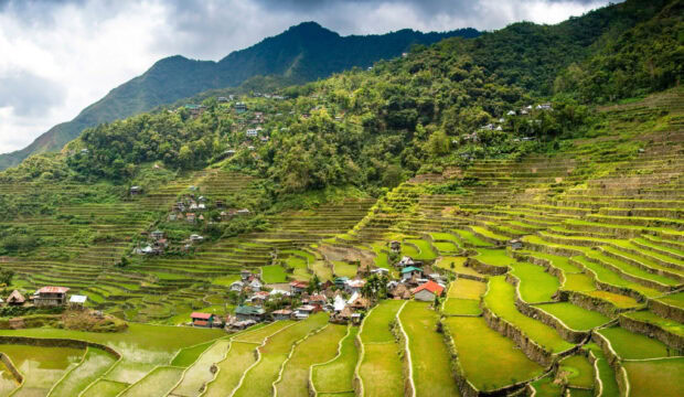 Traditional village surrounded by rice terraces in Philippines mountain region