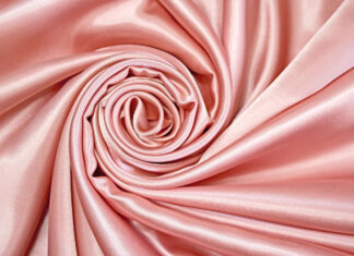 A close up view of pink silk fabric folded in a spiral pattern showing smooth texture, HD Desktop Wallpaper