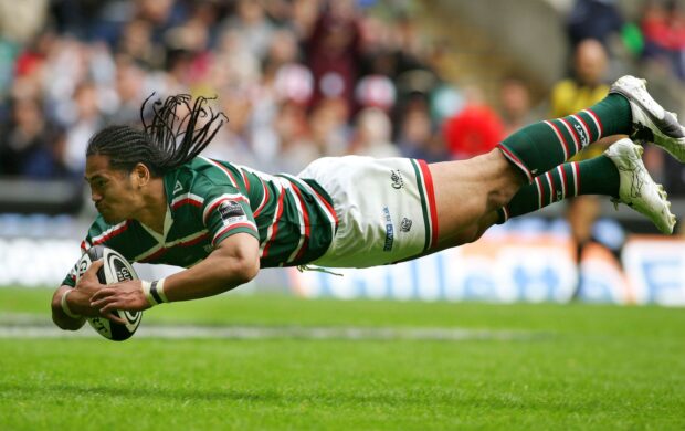 A rugby league player is diving to score a try during an intense match, 2K Desktop Wallpaper