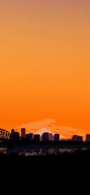 Portland skyline with Mount Hood silhouette at sunset over the river